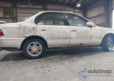 1997 Toyota Corolla Dx z USA, uszkodzony, nr VIN 2T1BB02E3VC181698